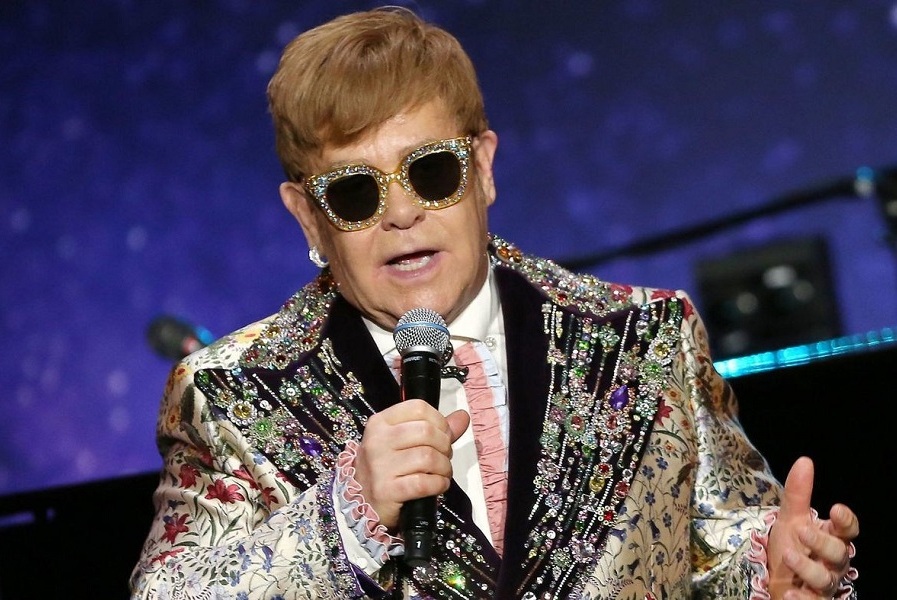 Elton John Sunglasses Photos - 50 Years of Elton John's Fabulously