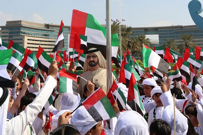 20,000 students join Sheikh Mohammed as he hoists flag marking the UAE’s Flag Day today