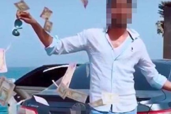 Мужчина арестован за разбрасывания денег ради популярности в социальных сетях