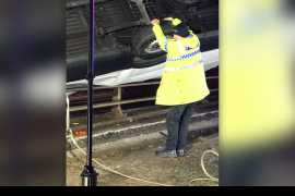 &#039;Superman&#039; police officer holds on to van to stop it falling off bridge