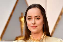 Dakota Johnson flaunts Cartier jewels at the 89th Academy Awards